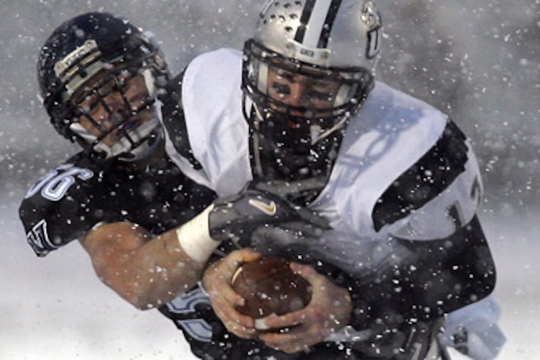 Villanova's Tim Kukucka sacks New Hamshire quarterback Kevin Decker in the second quarter of 'Nova's 46-7 victory yesterday. (David Swanson / Staff Photographer)