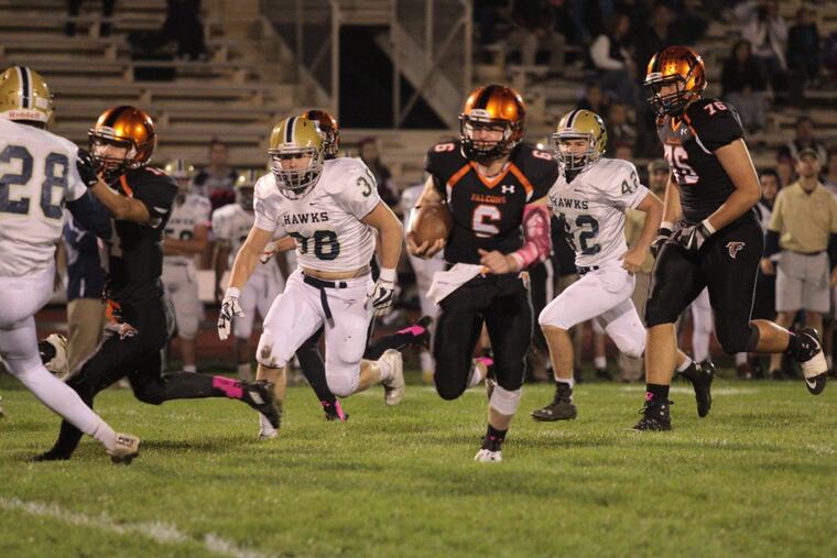 Pennsbury quarterback Zach DeMarchis (6) looks for running room in a 25-14 win over Council Rock South.