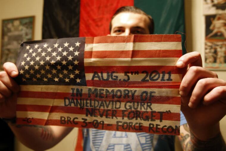 Kevin Daly is eager to travel thousands of miles to bring a discarded memorial flag he found in Afghanistan to its rightful home.
