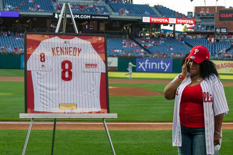 Sixty-five years after his debut, John Irvin Kennedy is honored by the Phillies for being their first African American player. Tazena Kennedy, John's daughter, wipes away tears as his jersey was unveiled on Wednesday night.