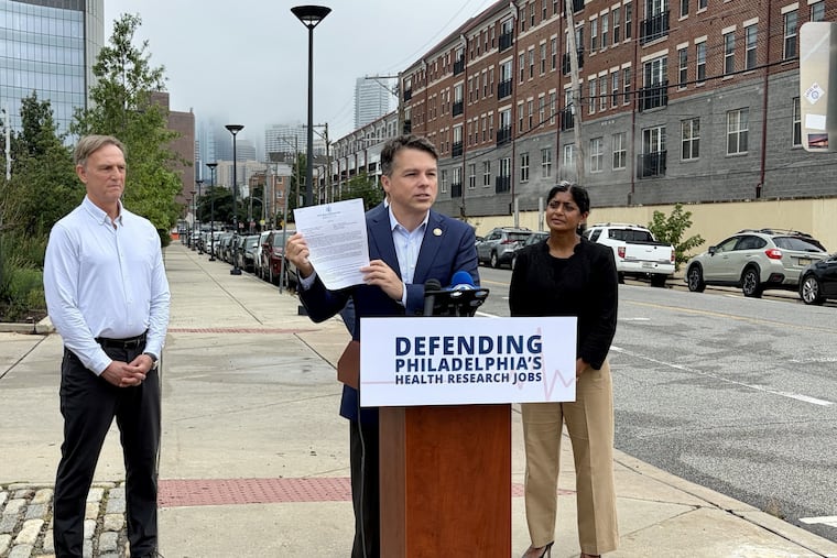 Rep. Brendan Boyle holds the formal letter he sent to AHRQ and OMB on Wednesday.