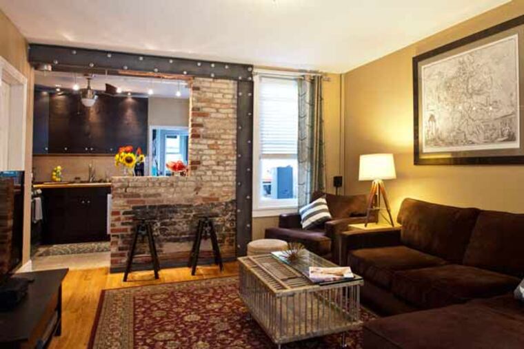 The living room in the home of Joe Horan and Kate Davis-Horan. Both architects, they knew how to go about updating the space while keeping the charm.