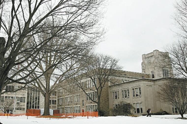 Lower Merion High School in Ardmore, with the district’s administration building at right, has an enviable academic reputation. (CHARLES FOX / Staff Photographer)
