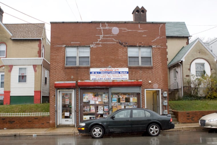 The exterior of Upper Darby building (center), where an apartment was the target of burglaries and where a puppy was found drowned.
