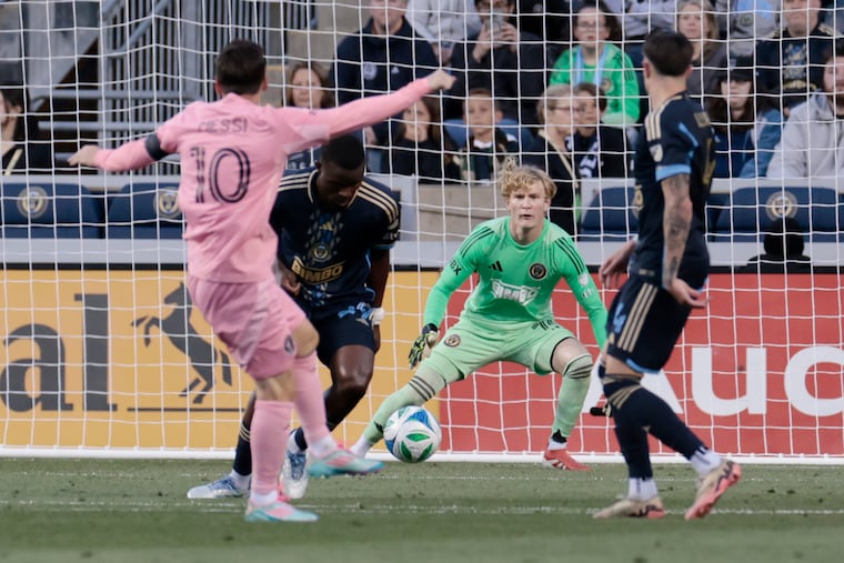 Lionel Messi lines up a shot at Union goalkeeper Andrew Rick during the first half.