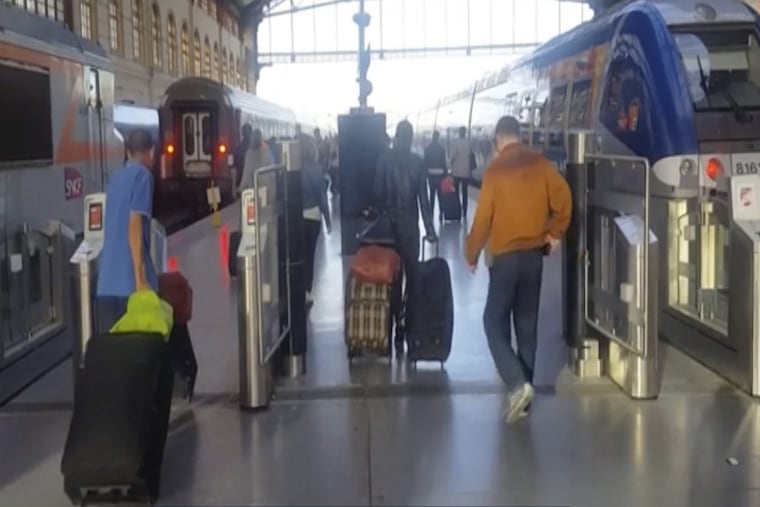 This image taken from video shows passengers inside Marseille-Saint-Charles railway station in Marseille, France on Sunday Sept. 17, 2017. Four young US tourists were attacked with acid Sunday at a train station in the French city of Marseille.