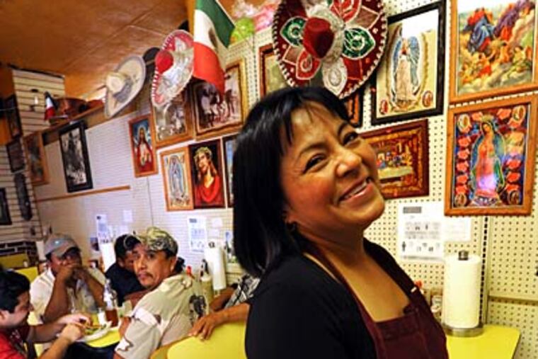 Latino community activist Carmen Guererro at Los Potrillos taqueria where she works. APRIL SAUL / Staff Photographer