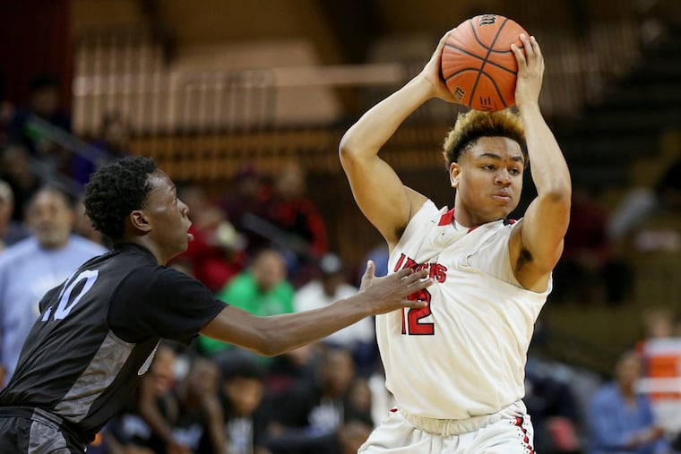 Haddonfield’s Lewis Evans (12) looks to pass the ball around Newark Central’s Joel Uzoka-Simmons (10) during the Group 2 state championship game.