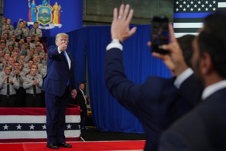 President Donald Trump departs as FBI Director Kash Patel, right, watches at the David Mack Center for Training and Intelligence, Friday, Aug. 14, 2026, in Garden City, N.Y.