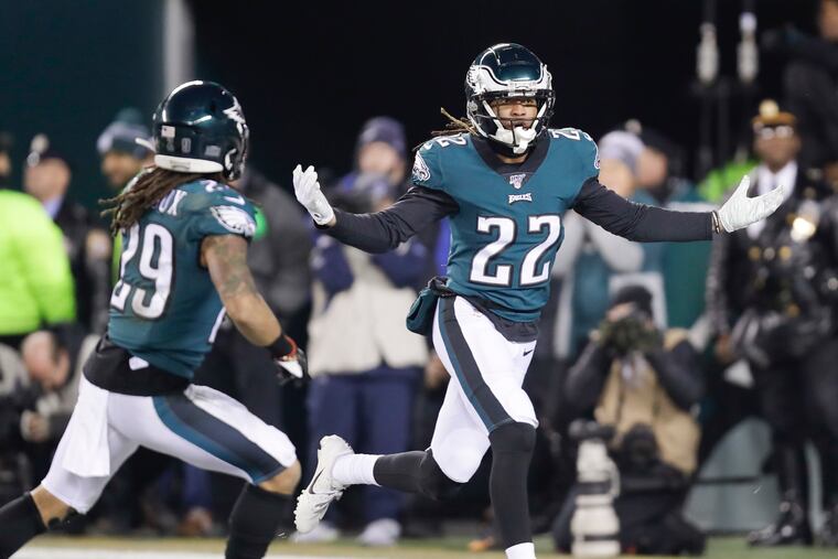 Eagles cornerbacks Sidney Jones and Avonte Maddox celebrating Jones' defensive stop against the Dallas Cowboys on Dec. 22.