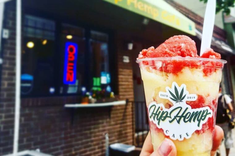 A cup of Cheerful Cherry and Mellow Mango CBD-infused water ice at the Hip Hemp Cafe near 7th and South Streets in Philadelphia.