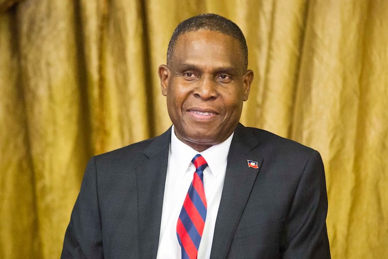 FILE - In this Aug. 7, 2018, file photo, Haiti's prime minister Jean-Henry Ceant sits during his appointment ceremony at the national Palace in Port-au-Prince, Haiti. Ceant has been thrown out of office by a no-confidence vote on Monday, March 18, 2019, prompted by government dysfunction and inability to quash inflation, blackouts and frequent opposition protests that have paralyzed the country.