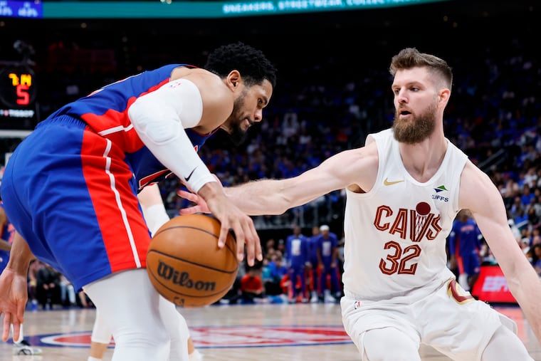 Cleveland Cavaliers forward Dean Wade (32) knocks the ball away from Detroit Pistons forward Tobias Harris during the Eastern Conference semifinals. Defense was Wade's calling card in Cleveland.