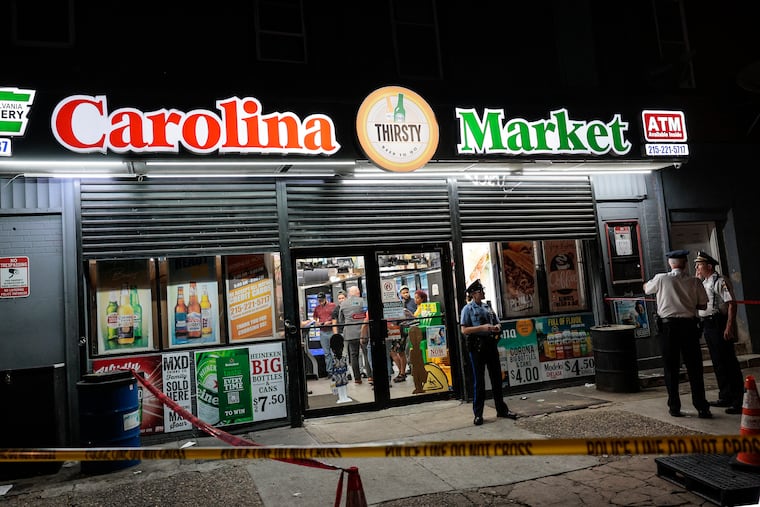 Police at Carolina Market on the 2600 block of West Lehigh Avenue where a 34-year-old cashier was shot multiple times Wednesday night.