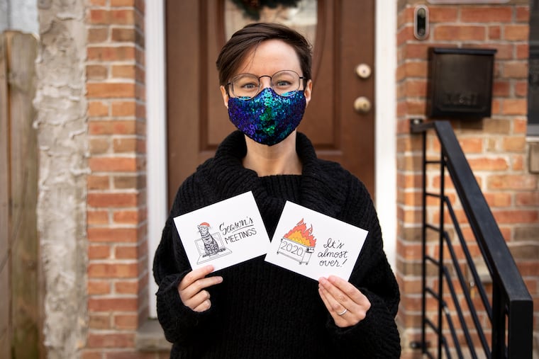 Kristin Everham, 35, of South Philadelphia, with her custom-made holiday cards.