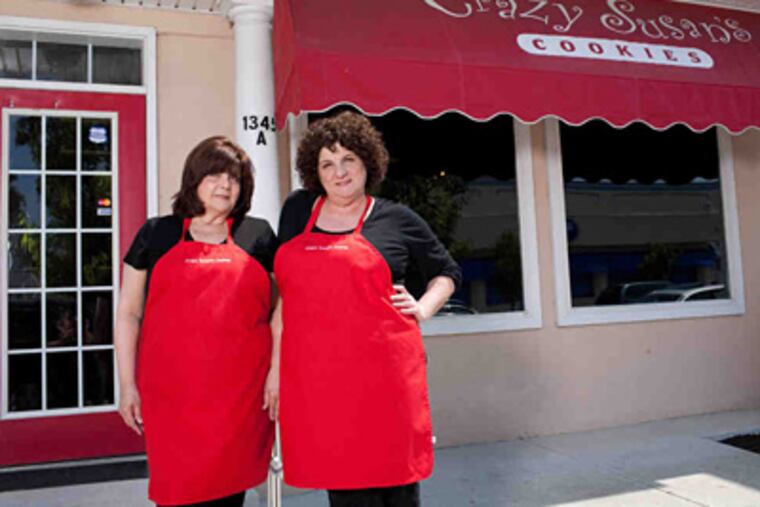 Owner Susan Adair (right) and manager Linda Brand in front of Crazy Susan's Cookie Company, as seen on Food Network's Tough Cookies Season 1. (Photo: Food Network)