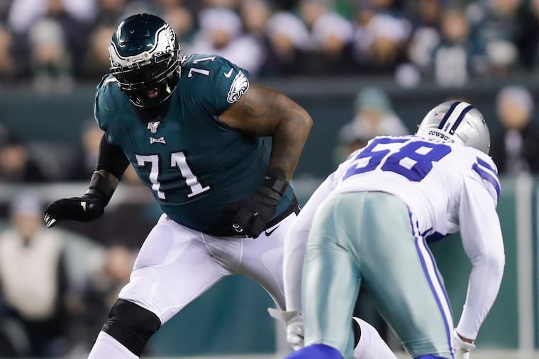 Eagles offensive tackle Jason Peters keeps an eye on Cowboys defensive end Robert Quinn during the Birds' 17-9 win Sunday.
