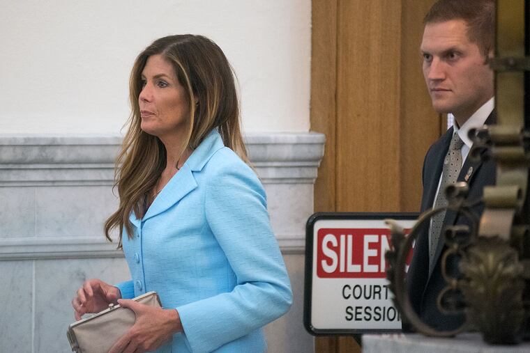 Pennsylvania Attorney General Kathleen Kane walks into the courtroom on the opening day of her trial at the Montgomery County Courthouse.