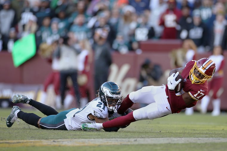 Eagles cornerback Ronald Darby pulls down Washington Redskins wide receiver Terry McLaurin during a game at FedEx Field in Landover, Md., on Dec. 15, 2019.