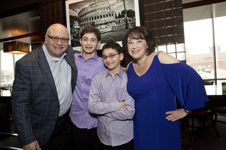 Ivy Elkins with her husband Ben and their sons Adam, 16, and Jared, 14.