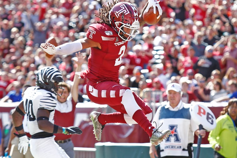 Temple receiver Isaiah Wright leaps into the end zone for a touchdown against Memphis in the second quarter.