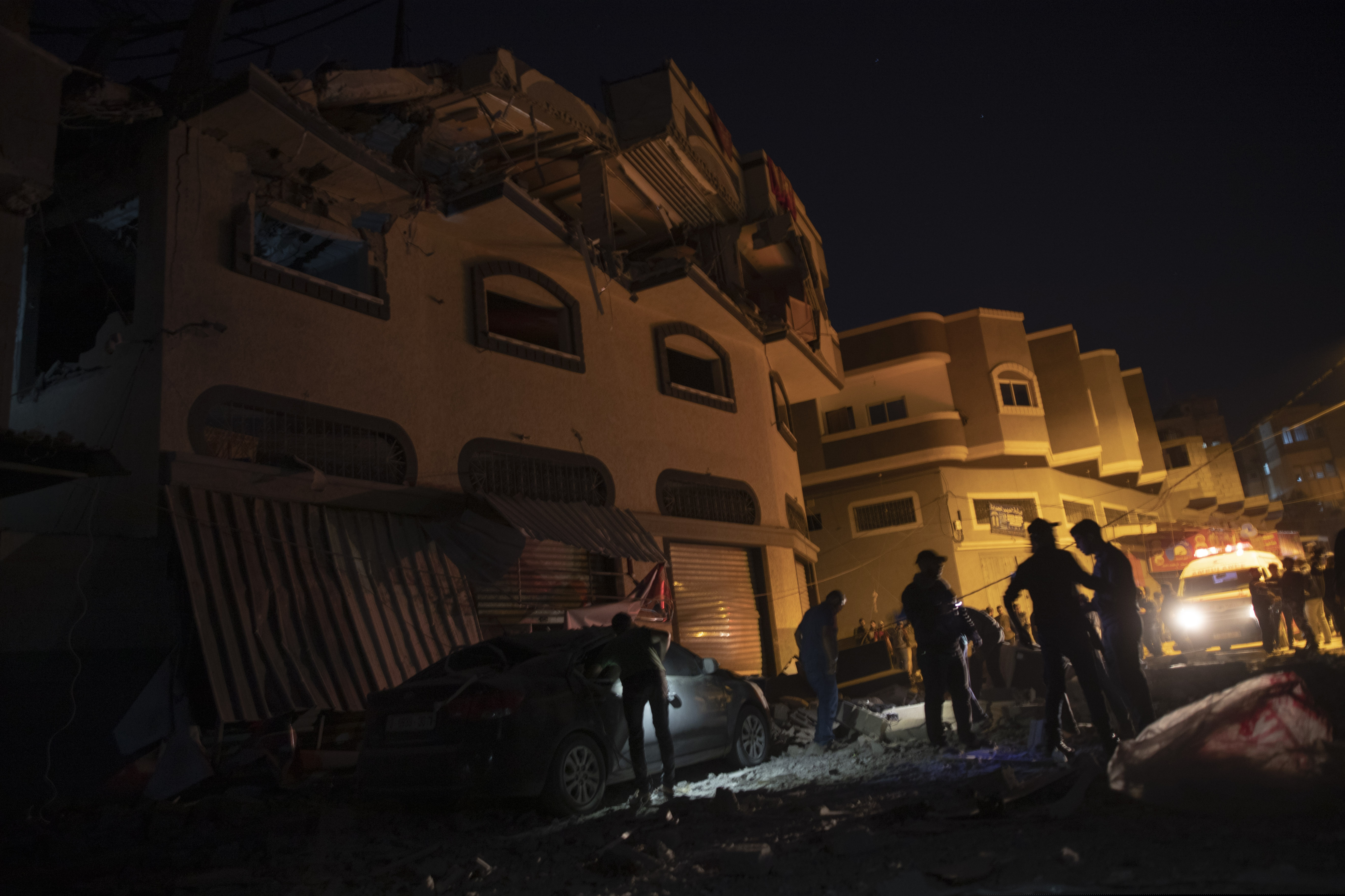 Palestinians check the damage of a house targeted by Israeli missile strikes in Gaza City on Tuesday.
