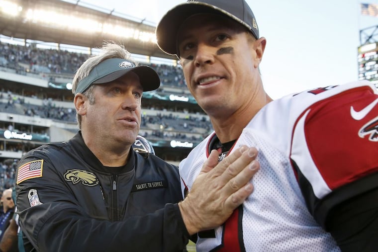 Eagles head coach Doug Pederson meets Atlanta Falcons quarterback Matt Ryan after the Eagles beat the Falcons on Sunday, November 13, 2016 in Philadelphia.