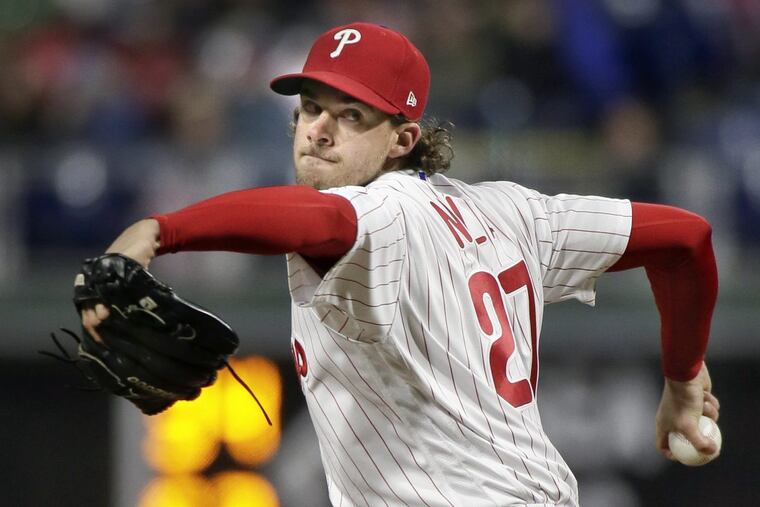 Aaron Nola tossed eight strong innings for his first win of the season as the Phillies beat the Reds, 6-1, on Tuesday at Citizens Bank Park.