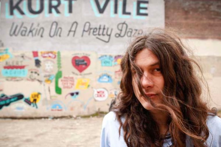 Kurt Vile stands in front of a mural in Fishtown which became the cover art for "Wakin On A Pretty Daze." March 27, 2013. ( MICHAEL S. WIRTZ / STAFF PHOTOGRAPHER ).