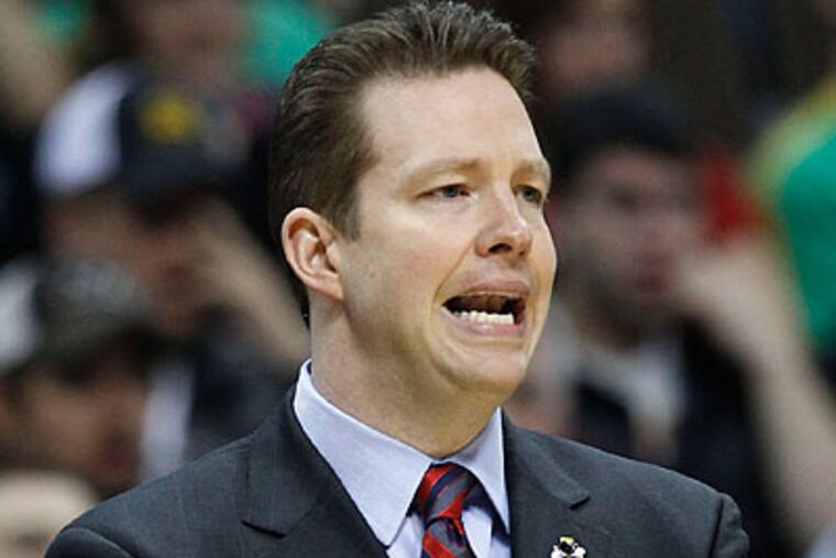 With Chris Mooney at the helm, Richmond has made major headlines in the NCAA Tournament. (Ed Andrieski/AP)