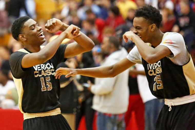 Villanova's Brandon Slater (left) and Team Honor teammate Isaiah Mucius showing off their dance moves at halftime of the 2018 Allen Iverson Roundball Classic. The 2019 game is set for Friday, April 26 at 6:30 p.m.