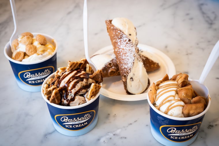 Bassetts Butter Pecan Ice Cream with Caramel Sauce and Amaretto cookies, Bassetts Coffee Fudge Truffle Ice Cream with pieces of Pizzelle and Chocolate Sauce, Bassetts Vanilla Ice Cream with Tiramisu Sauce and Cannoli pieces, and two Cannoli’s, at Nonna & Pop's, a dessert shop across from Termini Bros Bakery, opened by Vincent Termini Jr. and Joseph Termini in honor of their parents, Vincent Termini Sr. and Barbara Termini, in Philadelphia, Tuesday, July 12, 2022.