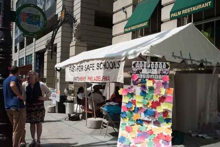The tent for members of the hunger strike sits on Broad Street in Philadelphia, on June 26, 2013. The hunger strike is being put on by Philadelphia School System employees after the passing of the Doomsday budget. ( Andrew Renneisen / Staff Photographer )