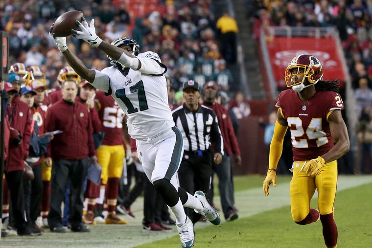 Alshon Jeffery pulls in a pass in front of Redskins cornerback Josh Norman.
