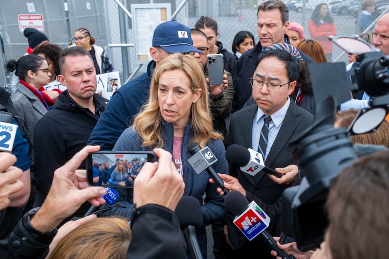 New Jersey Gov. Mikie Sherrill and Sen. Andy Kim (D-N.J.), right, speak to reporters outside of the Delaney Hall immigrant detention center in Newark, N.J. last month.