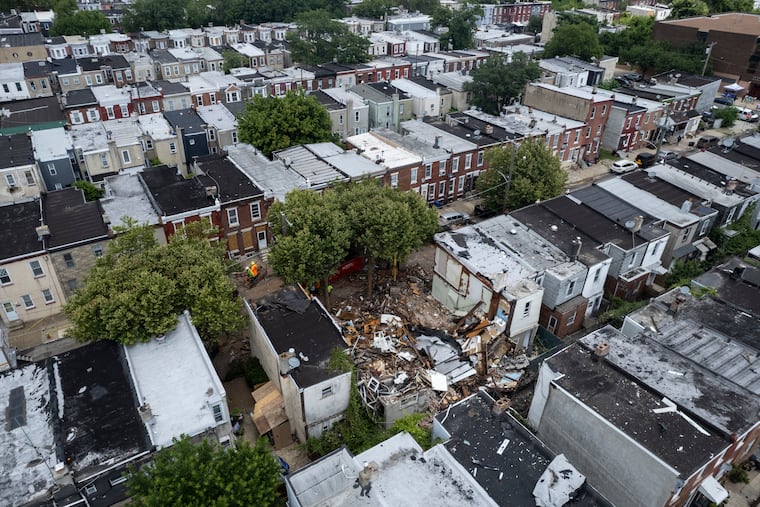 A drone view of the collapsed homes on the 1900 block of West Bristol Street on June 30 in Philadelphia's Nicetown section. Three rowhouses collapsed after a fire and explosion. One person was found dead at the scene.