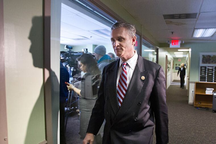 Congressman Robert E. Andrews walk towards the press conference where he announced his resignation at his office in Haddon Heights, February 4, 2014. ( DAVID M WARREN / Staff Photographer )