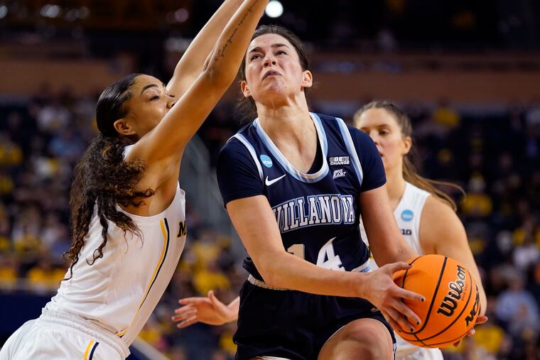 Villanova forward Brianna Herlihy (14) attempts a layup as Michigan guard Laila Phelia defends during the second half of a college basketball game in the second round of the NCAA tournament, Monday, March 21, 2022, in Ann Arbor, Mich. (AP Photo/Carlos Osorio)