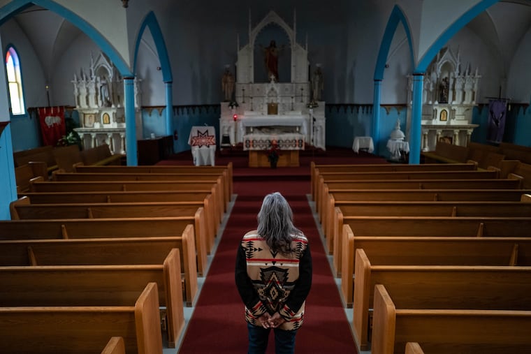 Clarita Vargas, 64, one of the survivors of St. Mary’s Mission, an Indian boarding school, stands in the St. Mary’s church on the Colville Reservation on Feb. 20 in Omak, Wash.