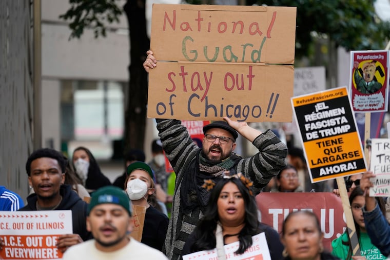 People march during a protest against President Donald Trump’s crime and immigration policies in Chicago on Saturday, Sept. 6, 2025.