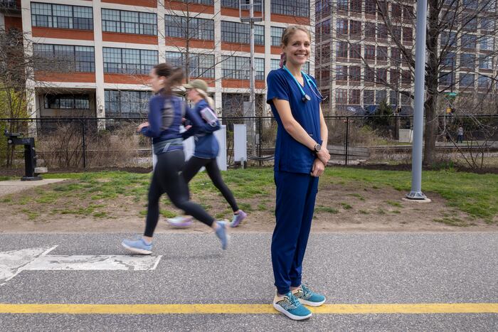 Marathoner nurse wearing scrubs sets record at Boston Marathon