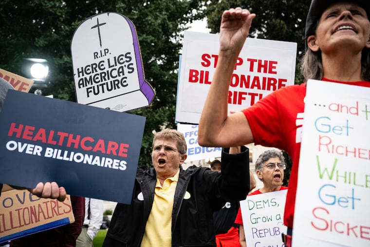 Demonstrators hold signs during a rally for healthcare funding outside the U.S. Capitol in Washington in September.
