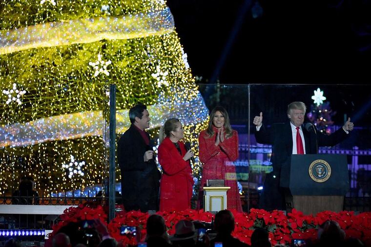 President Trump and first lady Melania Trump kick off the 95th annual National Christmas Tree Lighting with Dean Cain (left) and Kathie Lee Gifford on the Ellipse in Washington on Thursday.