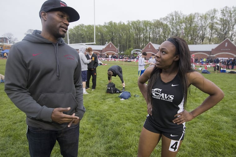 Girard College track Coach Diamond Woolford (left) talks with star sprinter Thelma Davies.