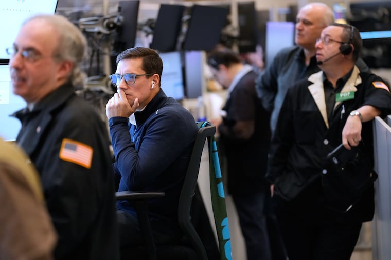 Traders work on the floor at the New York Stock Exchange in New York, Monday, March 2, 2026.