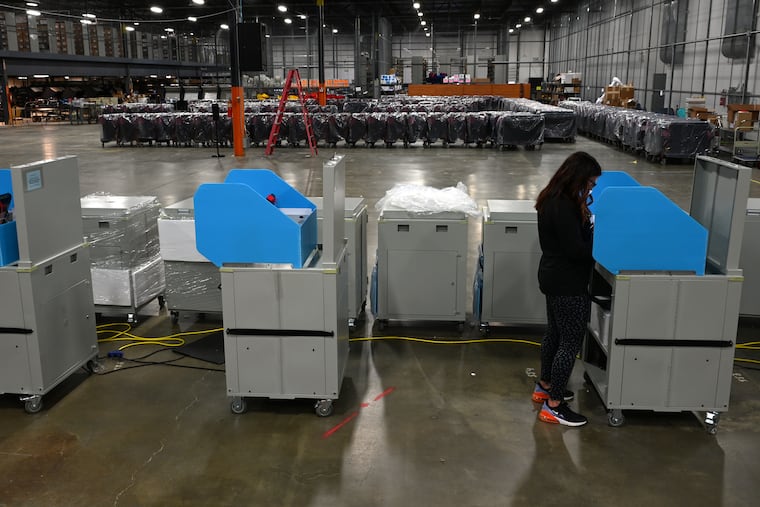 Meghan Ferguson casts her ballot at the Camden County Elections and Archive Center in Blackwood in October 2021.