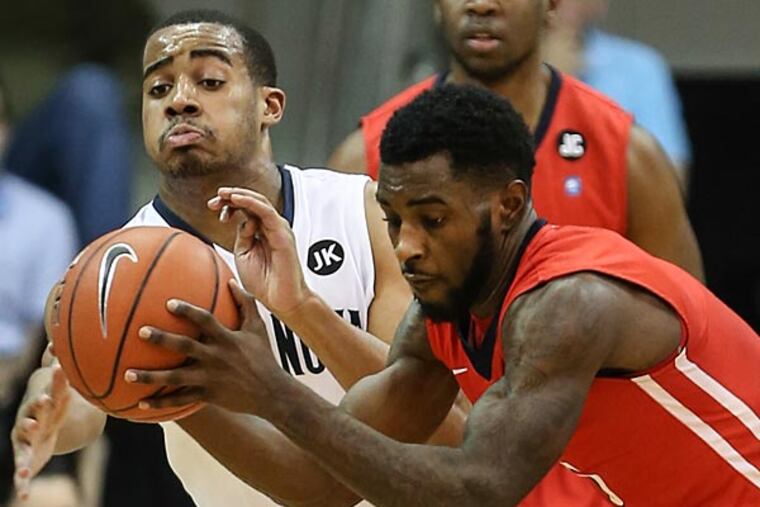 Villanova's Phil Booth tries to take the ball from NJIT's Damon Lynn. (Steven M. Falk/Staff Photographer)