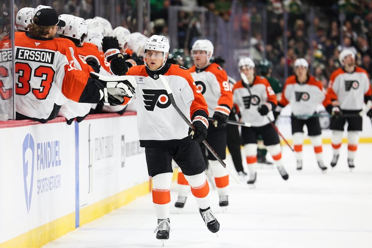 Flyers defenseman Emil Andrae (center) celebrates with his teammtes after scoring during the first period against Minnesota.