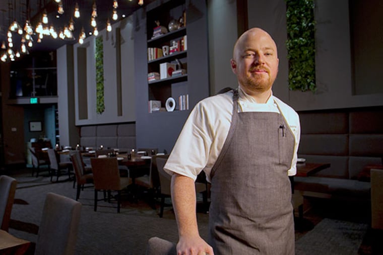 Chef Justin Bogle stands in the dining room of Avance on Thursday, December 12, 2013.Avance a new restaurant in the location of the old Le Bec-Fin at 1523 Walnut St. in Philadelphia. ( ALEJANDRO A. ALVAREZ / STAFF PHOTOGRAPHER )