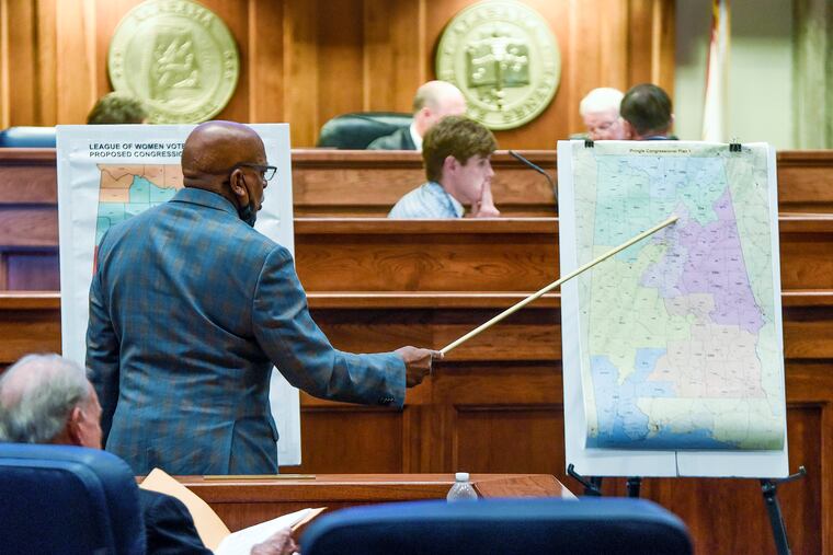 Sen. Rodger Smitherman compared U.S. Representative district maps during a special session on redistricting at the Alabama Statehouse in Montgomery, Ala., in November.